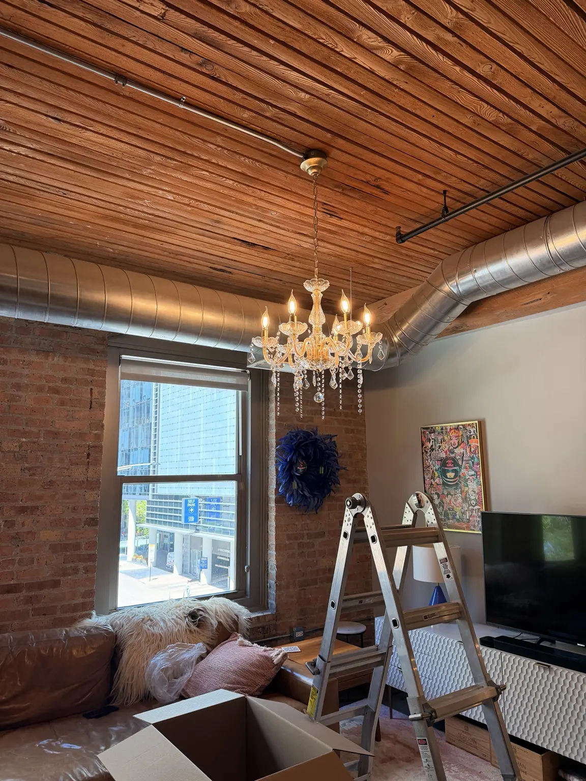 Crystal chandelier installed in a downtown Chicago loft