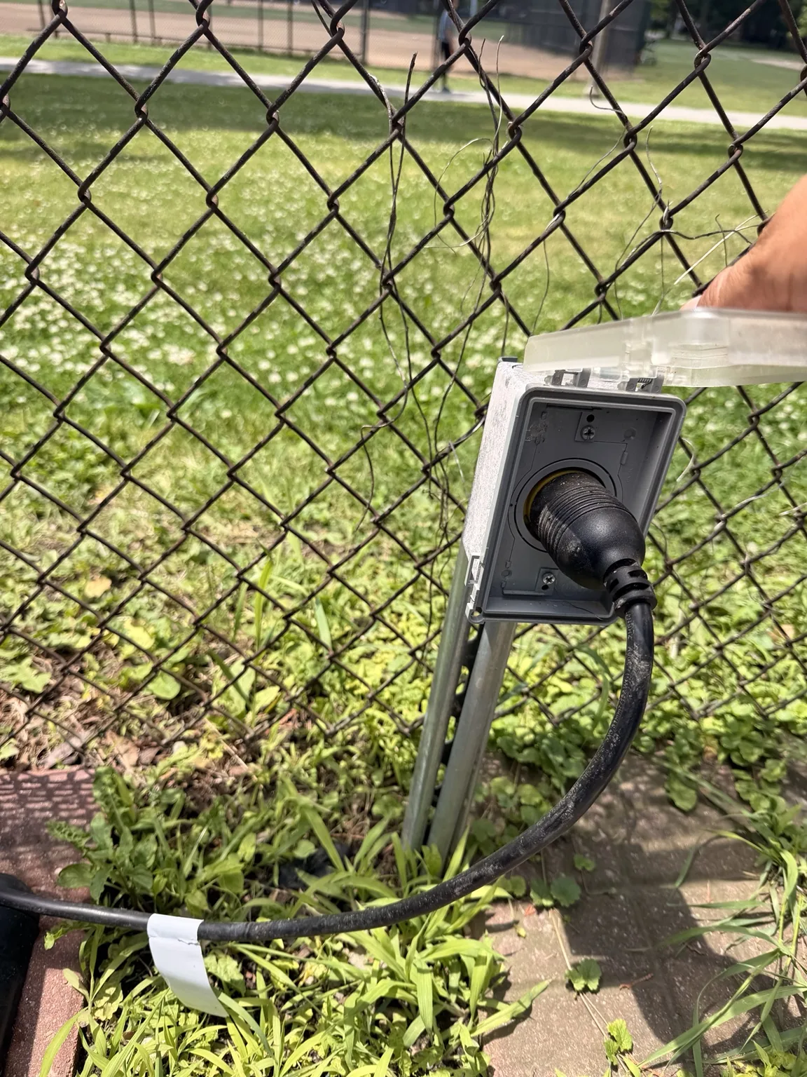 Close view of a weather-resistant outdoor GFCI receptacle enclosure